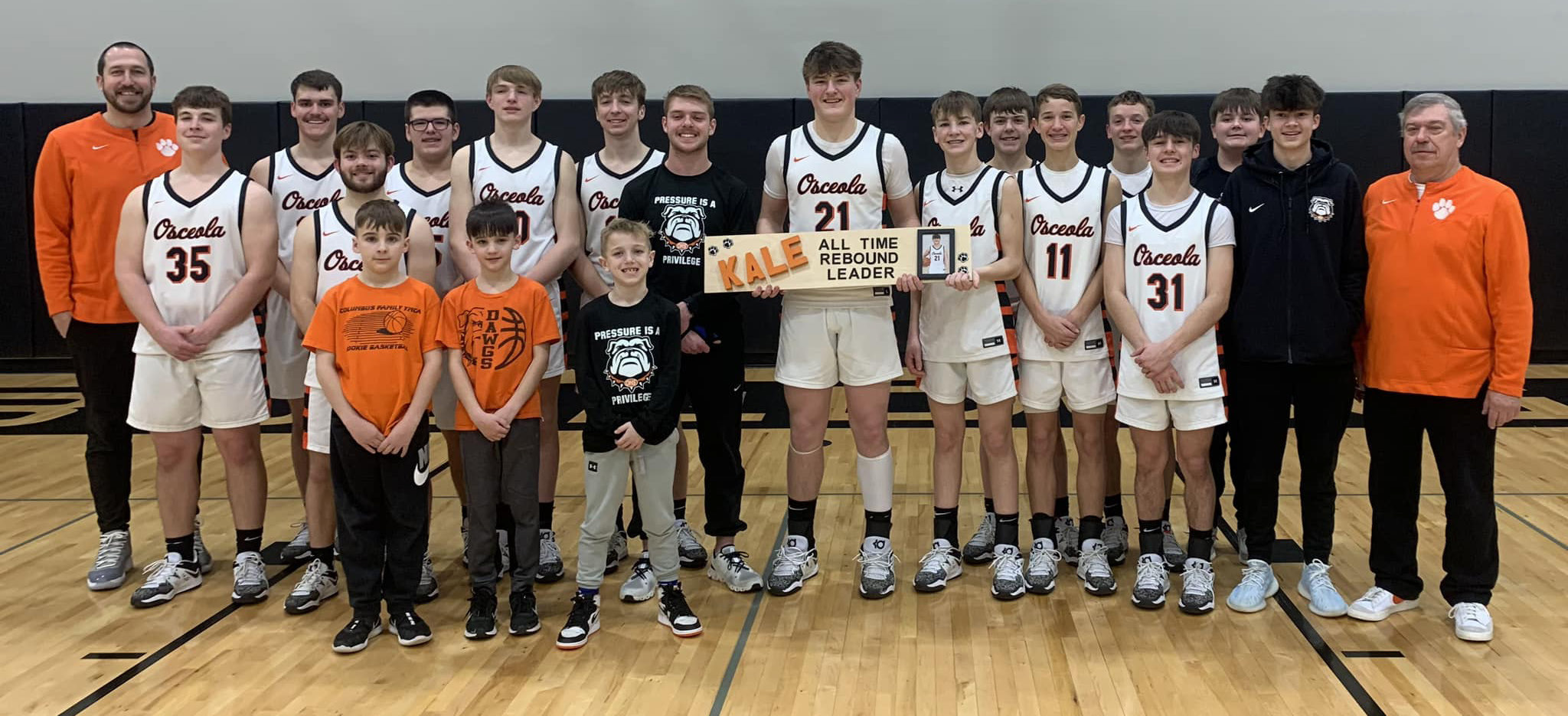 Kale Gustafson (center) is now the all-time rebound leader at Osceola. The junior big man broke a 56-year-old record that was previously held by Alan Gissler. Osceola Schools photo