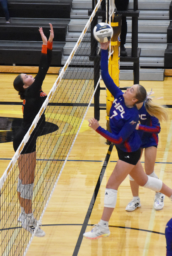 Above- High Plains sophomore Taya Hans looks for the tip winner against the Dorchester defense. 