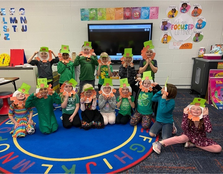 Kindergarteners celebrate St. Patrick's Day at school making leprechaun masks and eating green cake. Photo provided