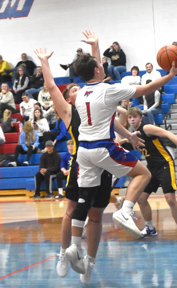 Left-High Plains 6-1 junior Kyler Hans (1) drives into the teeth of the Shelby-RC defense during Saturday’s Polk County match up in Polk