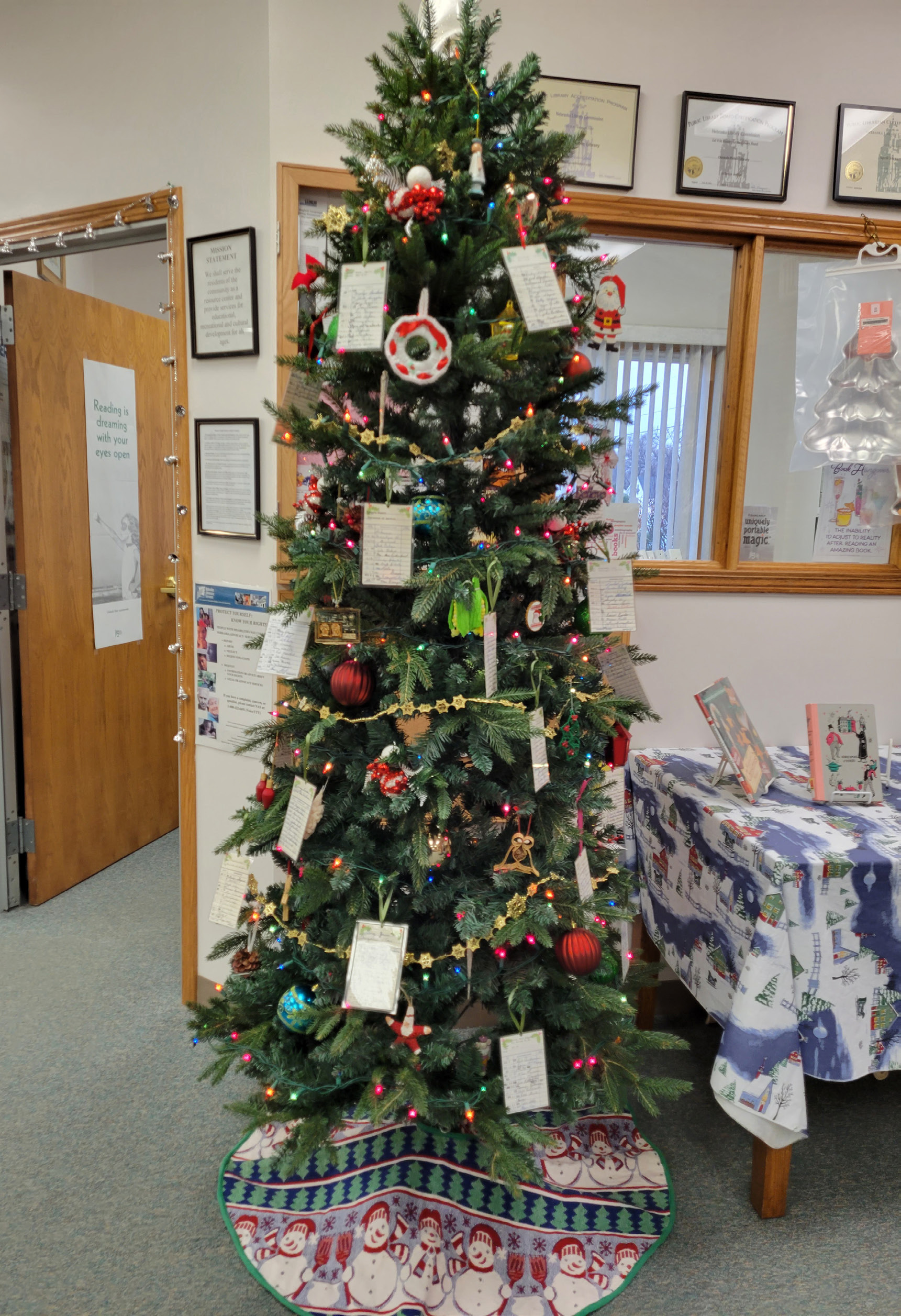 The tree at the Osceola library is decorated with vintage library cards for sale. Come get one for only $3 and support a good cause. PCN photos by Beth Sparrow