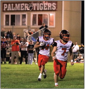 Brycen Kula carries the ball while Matt DeMers leads blocking. PCN photo by Blaine Winslow.