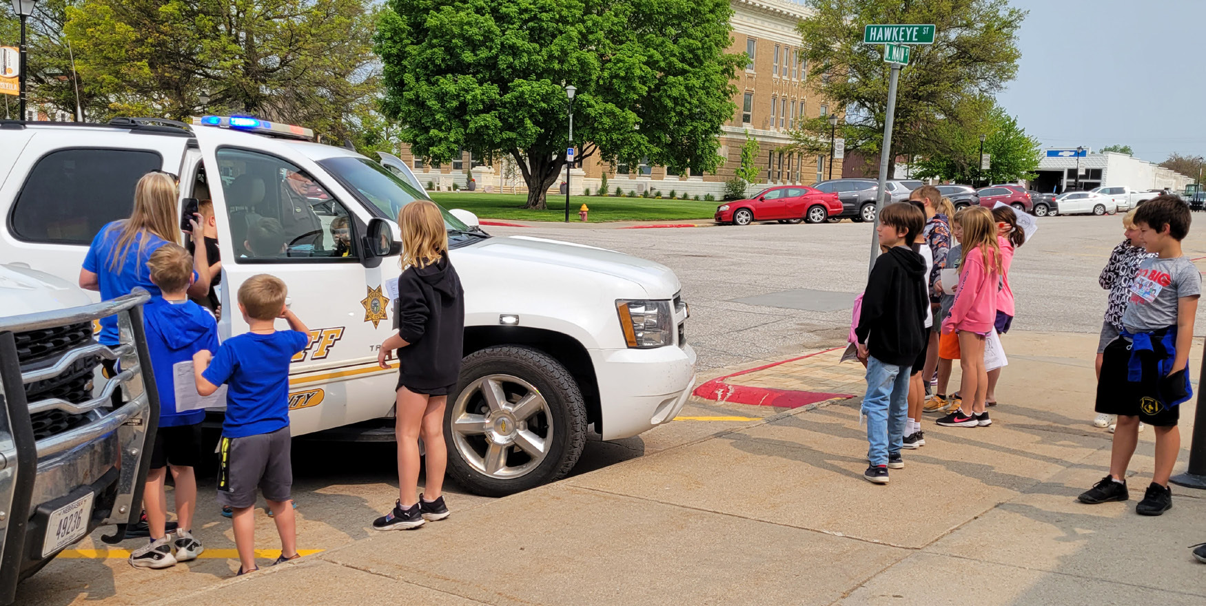 Shelby-Rising City second graders visited the Polk County Sheriff's office last week. Sheriff Ladwig let them look in his police vehicle and sounded the siren for them. Mrs. Gabel and Mrs. Luettel teach second grade. PCN photo by Beth Sparrow.