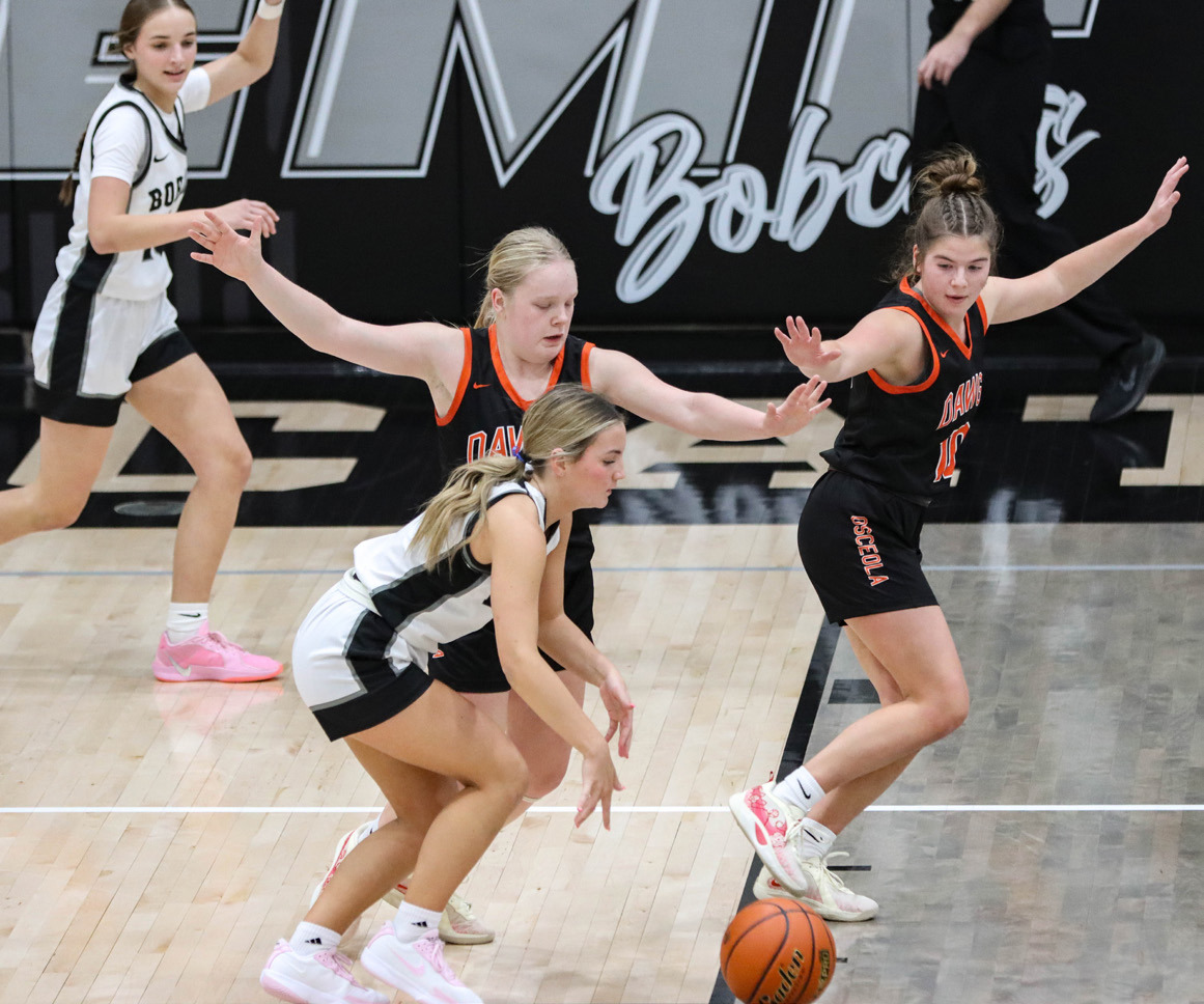 Janna Roberts and Addie Theis double team an EMF player on defense. PCN photo by Blaine Winslow.