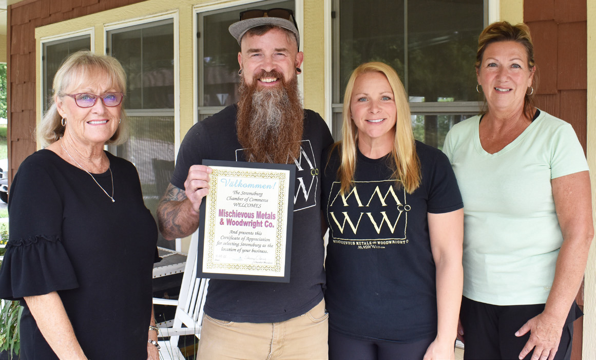 The chamber welcomes MMWW. Pictured are Cinda Koinzan, Jeff Lacy, Erin Lacy and Sherry Oberg. Polk County News Photo by Beth Sparrow