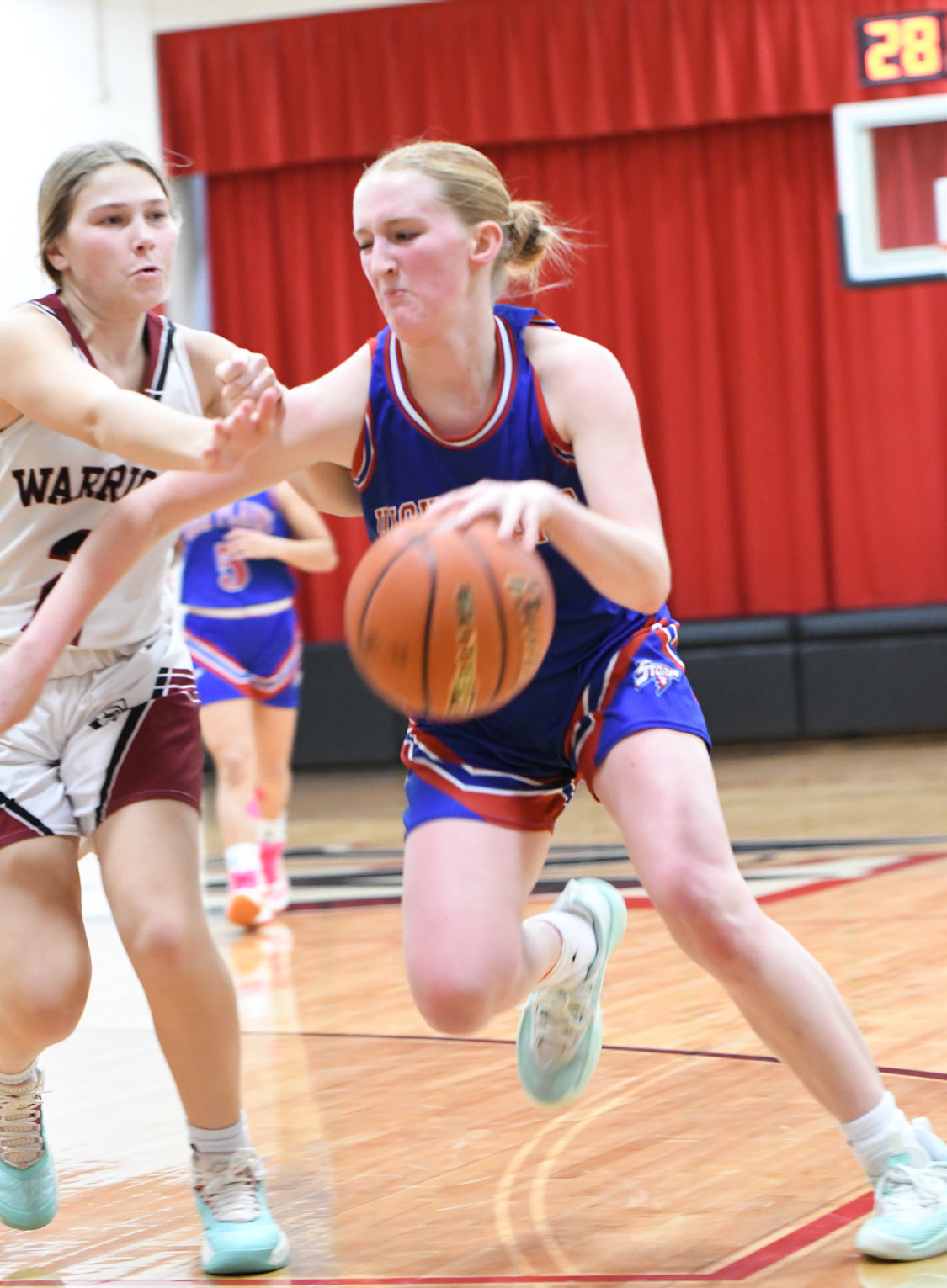 A determined Peyton Hofmann tries to dribble around a Fullerton defender. PCN photo by Rick Holtz.