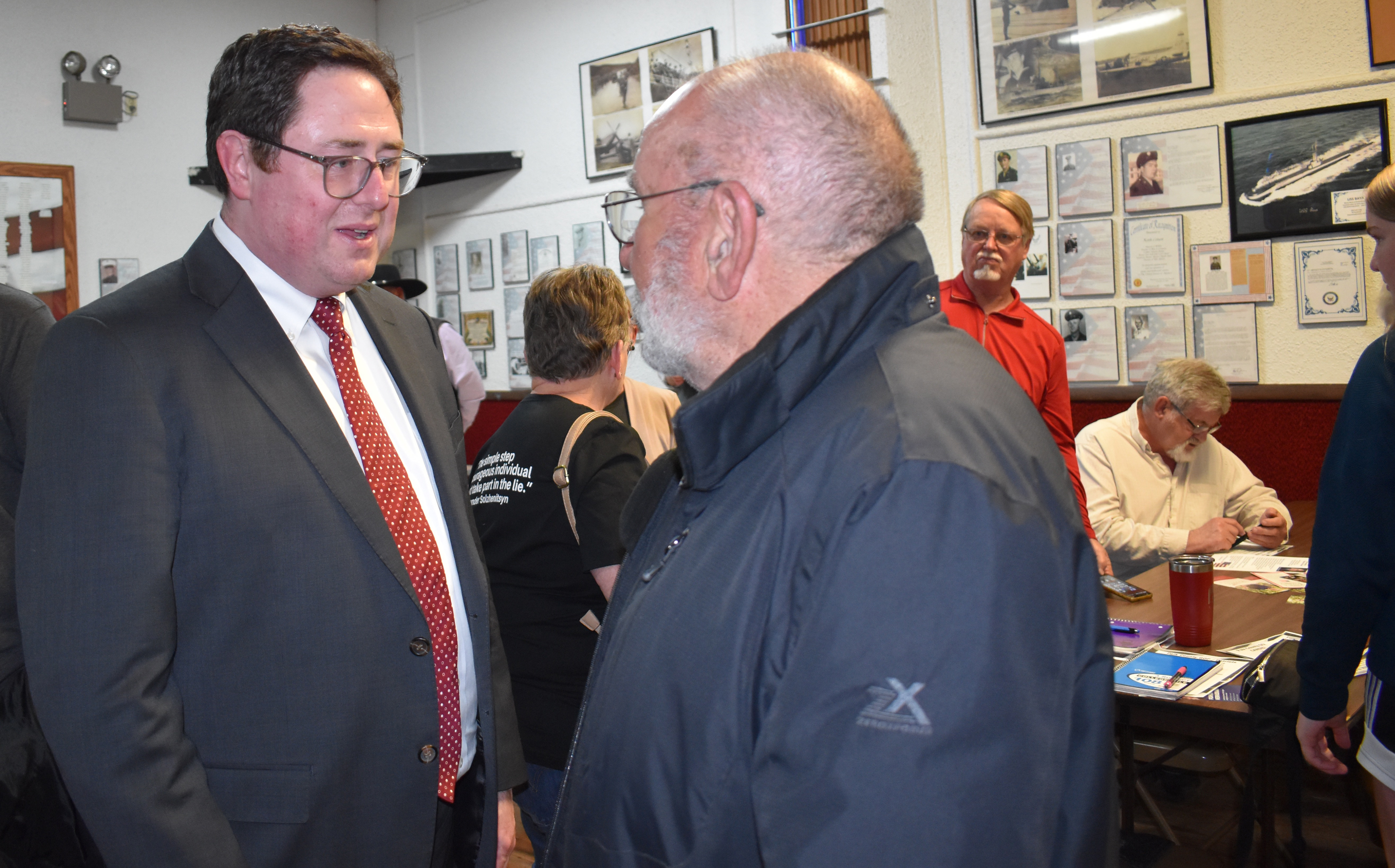 Mike Flood talks with Stromsburg Mayor Ken Everingham in May at a candidate forum. Polk County News File Photo