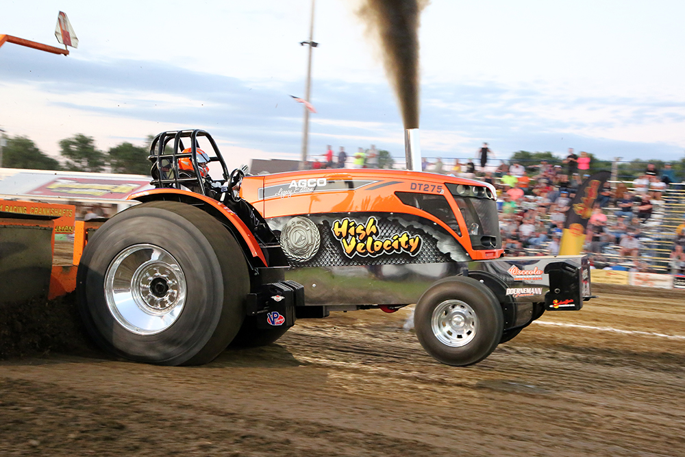 Kelsie and Garrett Davidson are third generation tractor pullers. What started with their grandfather, Leonard, and father, Todd, has turned into a weekend hobby for the duo. Garrett pulling in Rock Valley, Iowa. 