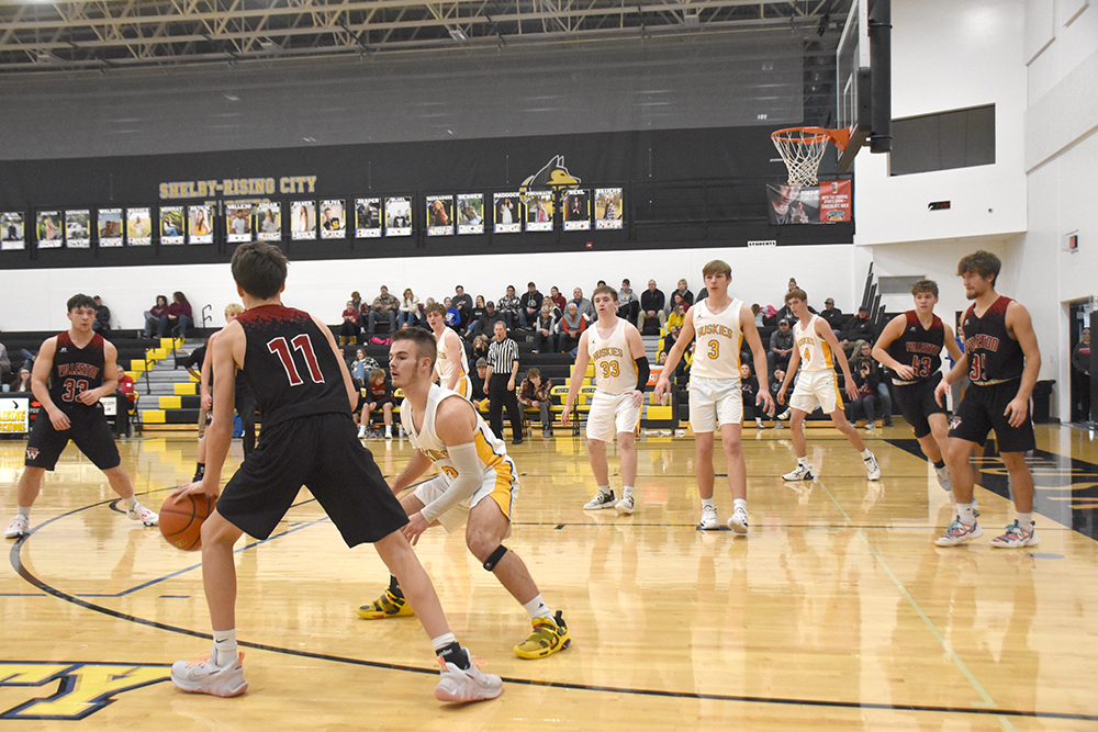 The Huskie defense held the Warriors to two points in the final 2:30 as Shelby-Rising City defeated Fullerton 64-53 in the opening round of the SRC Holiday Tournament. PCN photo by Beth Sparrow