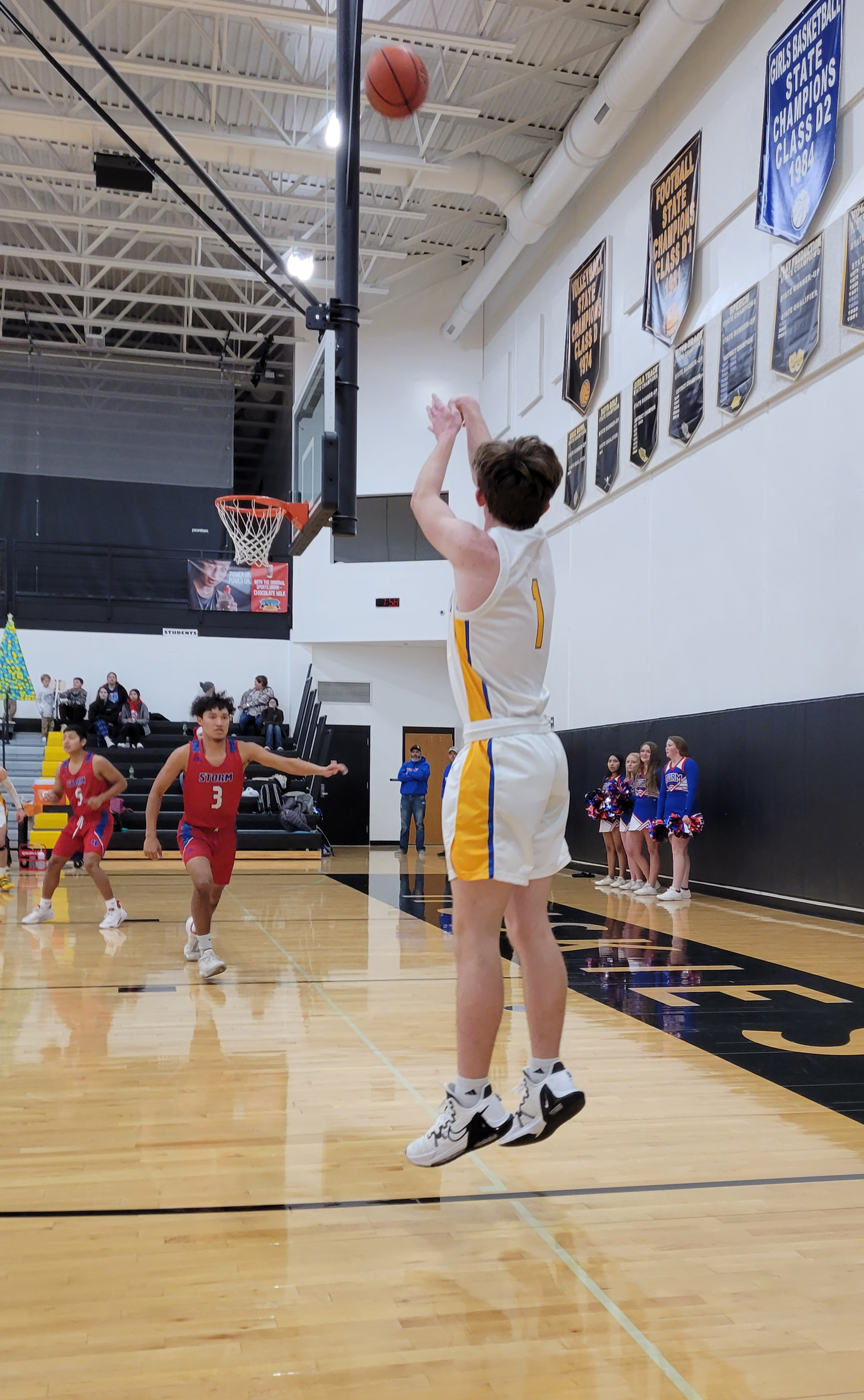 Gabe Dutton-Mofford takes a shot. Mario Lesiak waits for the rebound.
