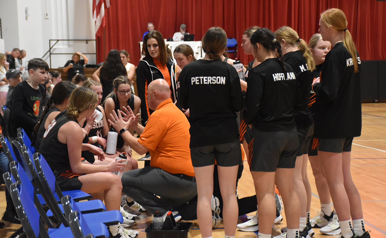 Osceola coach Brett Webster talks things over with his team during a timeout on Tuesday. PCN photo by Beth Sparrow