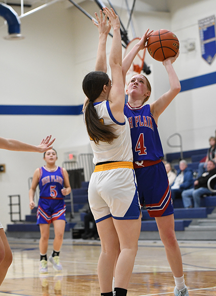 Peyton Hofmann goes up strong for a basket against Nebraska Lutheran. The freshman finished with 6 points in the loss. PCN photo by Rick Holtz