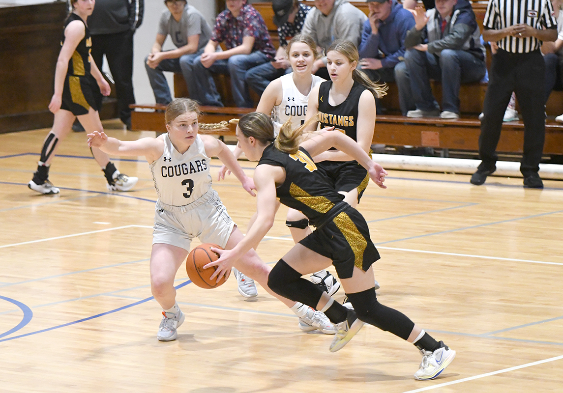 Ema Dickey had her hands full on defense when she was matched-up with McKenna Yates. Dickey scored a team-high 9 points and Yates finished with a game-high 17 points for McCool Junction. PCN photo by Rick Holtz