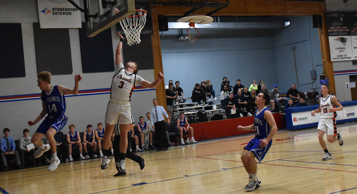 Isaiah Zelasney floats to the basket on a fast break for two of his team-high 24 points. PCN photo by Beth Sparrow