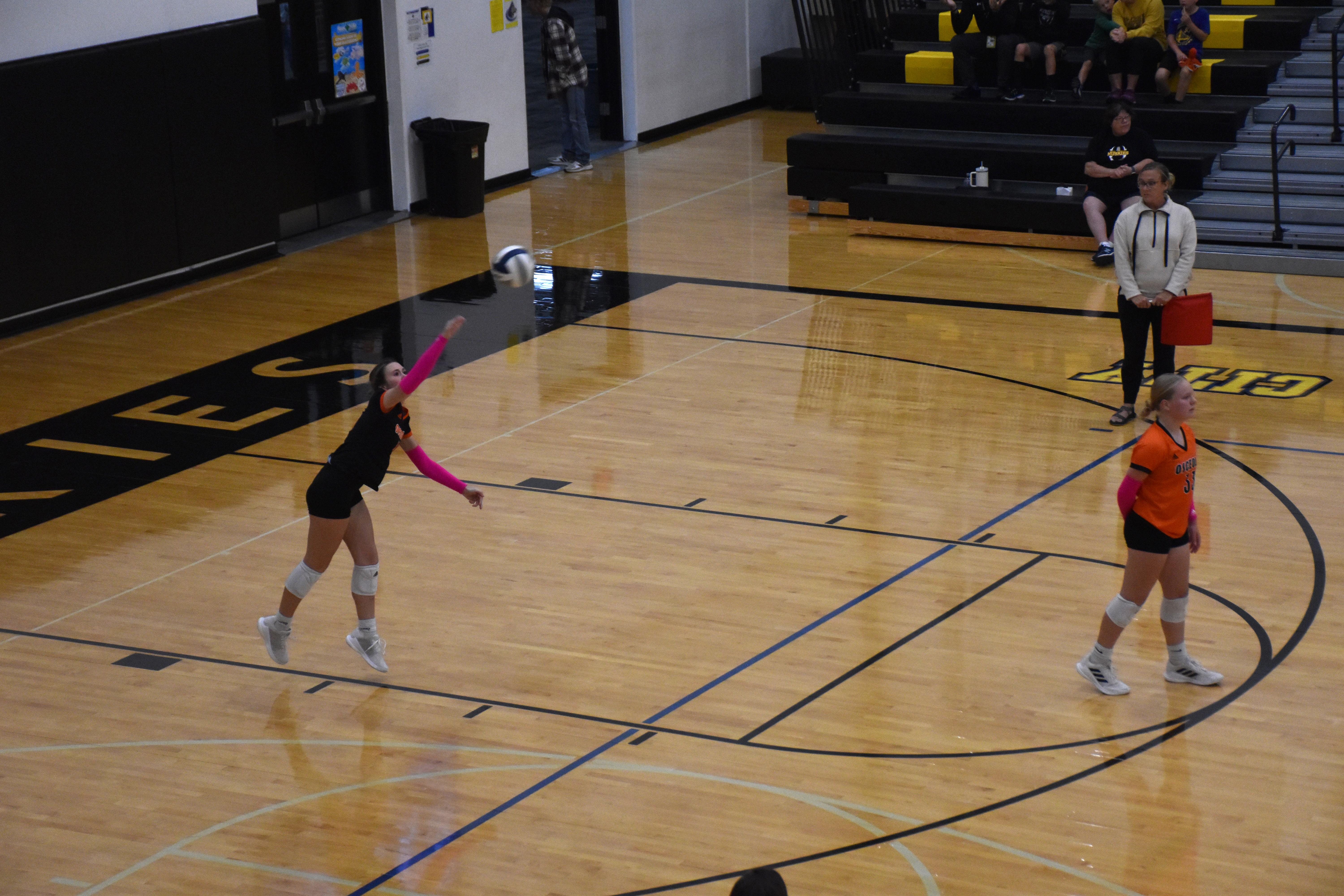 Ella Lemburg serves for Osceola. 