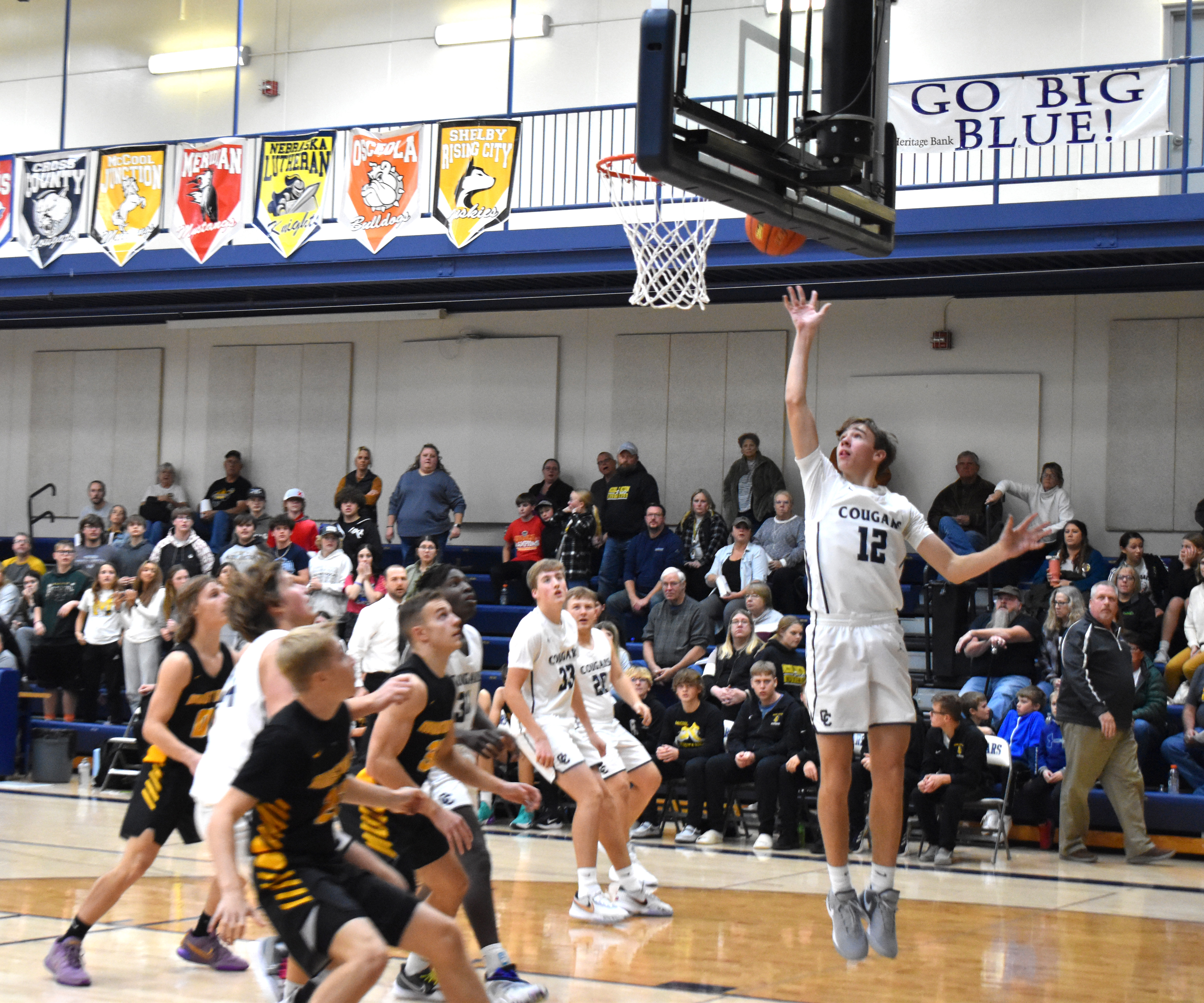 Thatcher Hanson takes the ball to the basket.