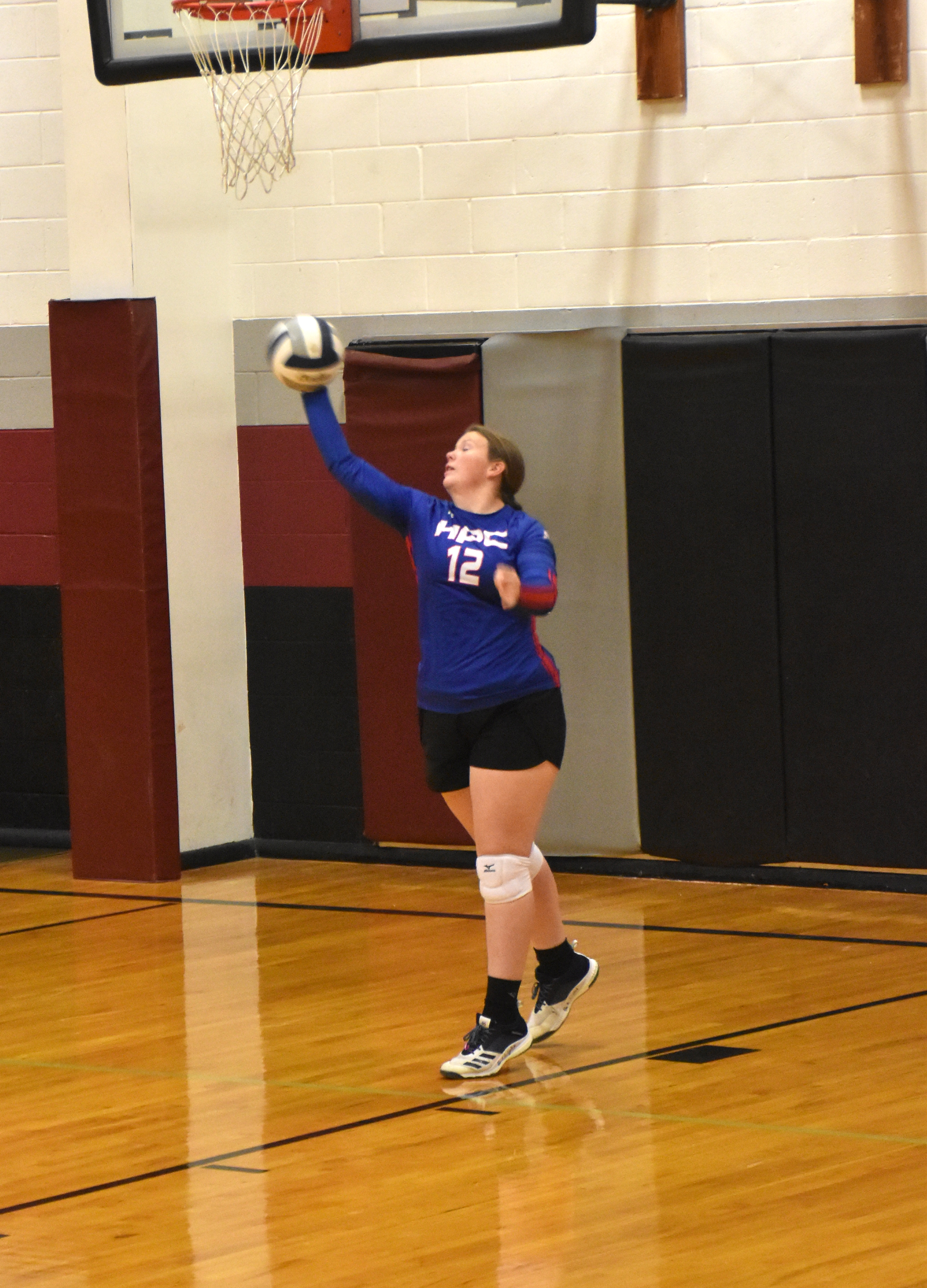 Allie Howell serving against Lawrence-Nelson.