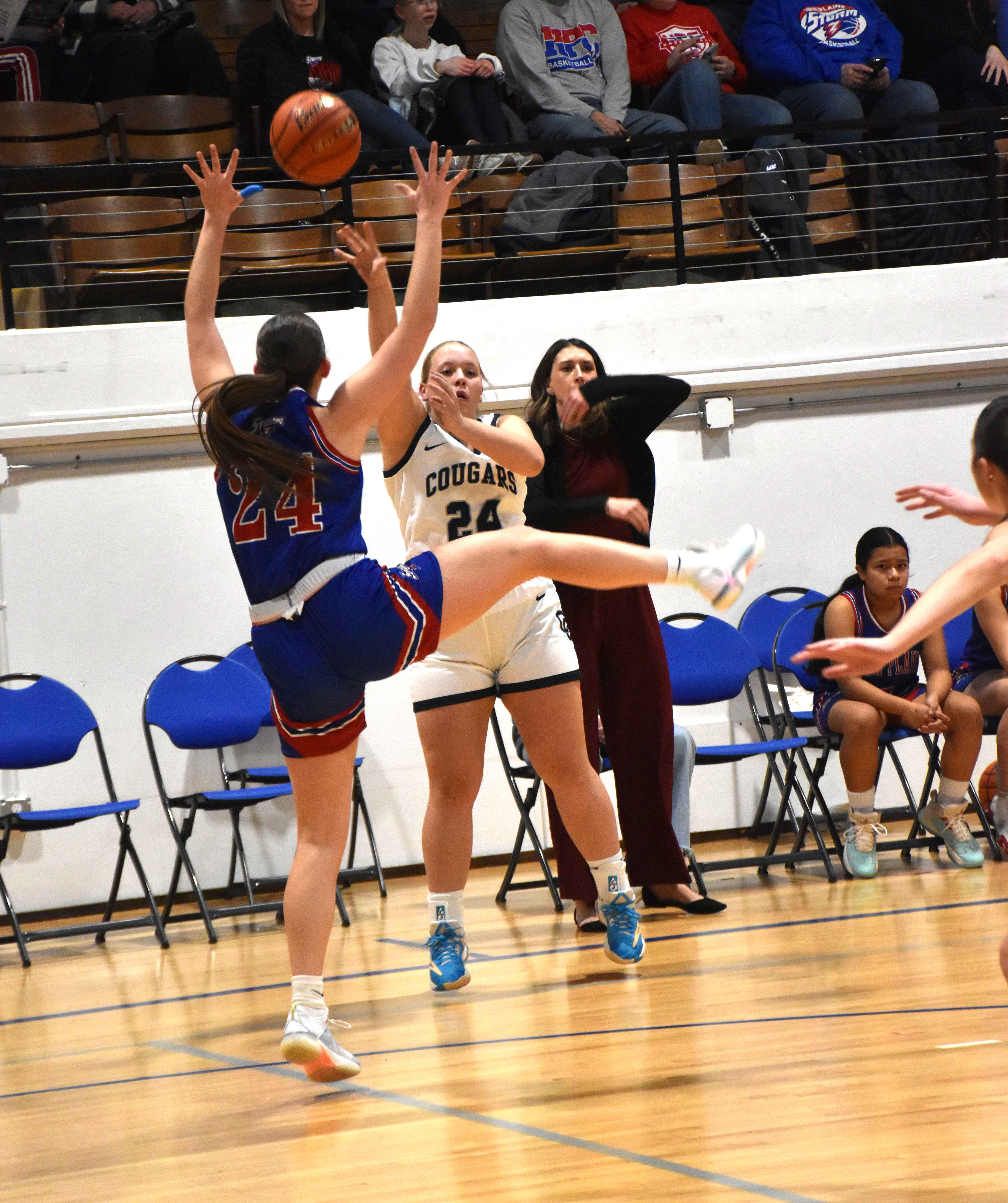 Chesney Sundberg (CC) tries to shoot one past Rylee Ackerson (HPC)