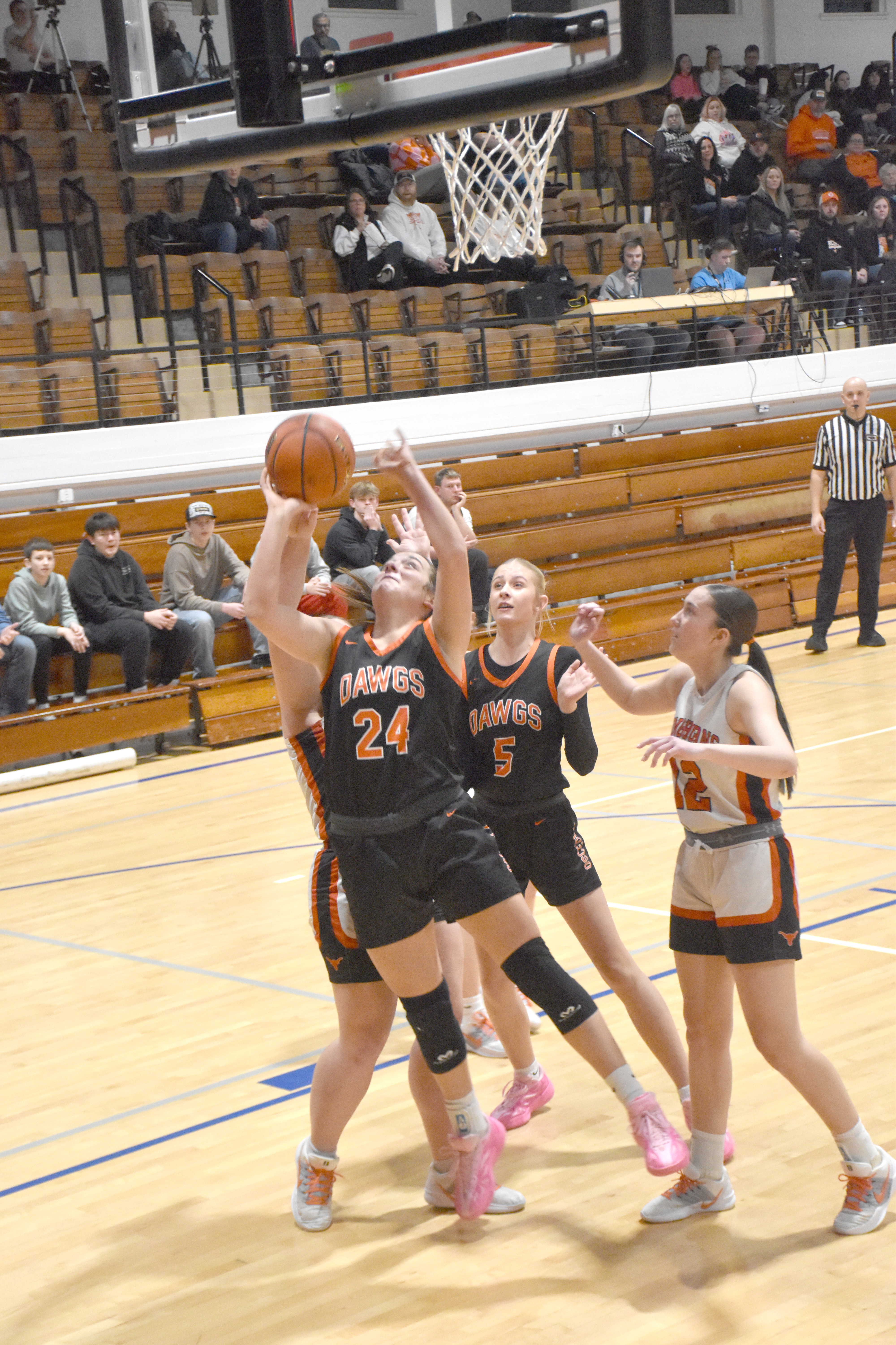 Bella Recker puts up a bucket.