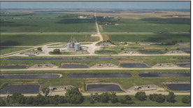 Above: Pillen Family Farms, owned by Nebraska Gov. Jim Pillen, has about 100 hog farms across the state, including Inland Foods in Hastings. Pigs on the site, a former munitions depot, are housed in converted bunkers. Photo by Loren Elliott For The New York Times 