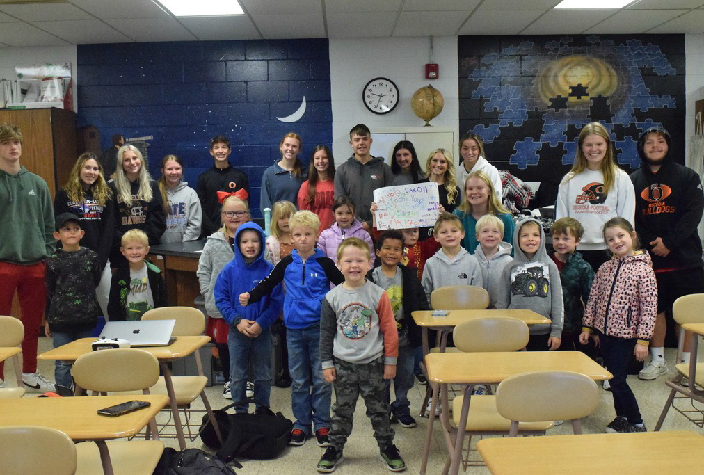 Mrs. Ericson’s kindergarten class visited Mr. Ericson’s high school chemistry class to see the high schoolers demonstrate experiments. The kids enjoyed watching the experiments. Photo provided.