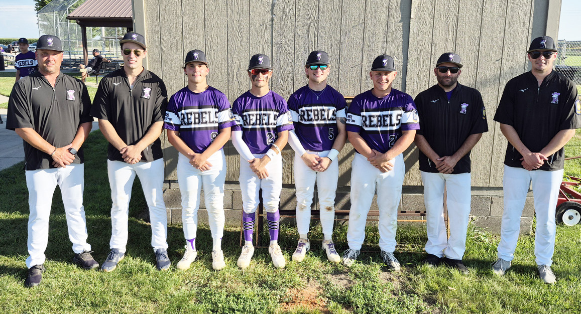 Flanked by coaches to their left and their right, these four players, Owen Krafka, Brayden Santos, Aden Feezell and Eli Fjell were a consistent contributor to the SOS baseball program since they became part of it. PCN photo by Ken Kush.