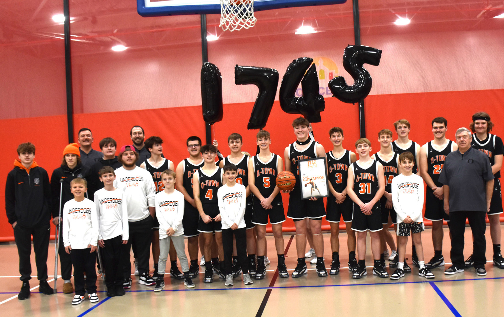 Above: Kale Gustafson (center) is pictured with his team after breaking the school career record for points. Below: Former record holder Isaiah Zelasney is pictured with Kale Gustafson. The two played together the last three years before Zelasney graduated. PCN photos by Beth Sparrow.