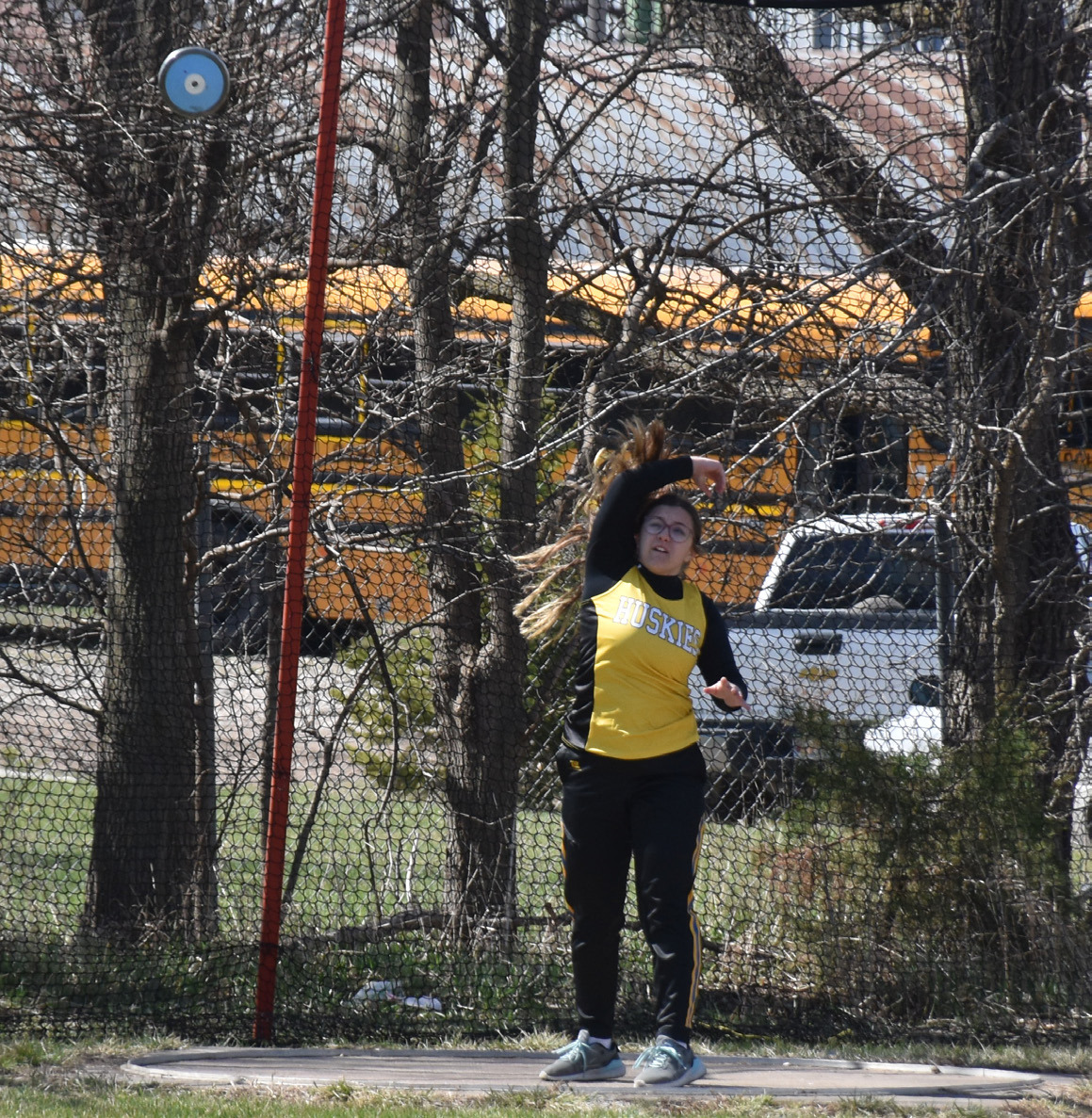 Left: Nevaeh Martinez (SRC) throws the discus at the Osceola meet. 