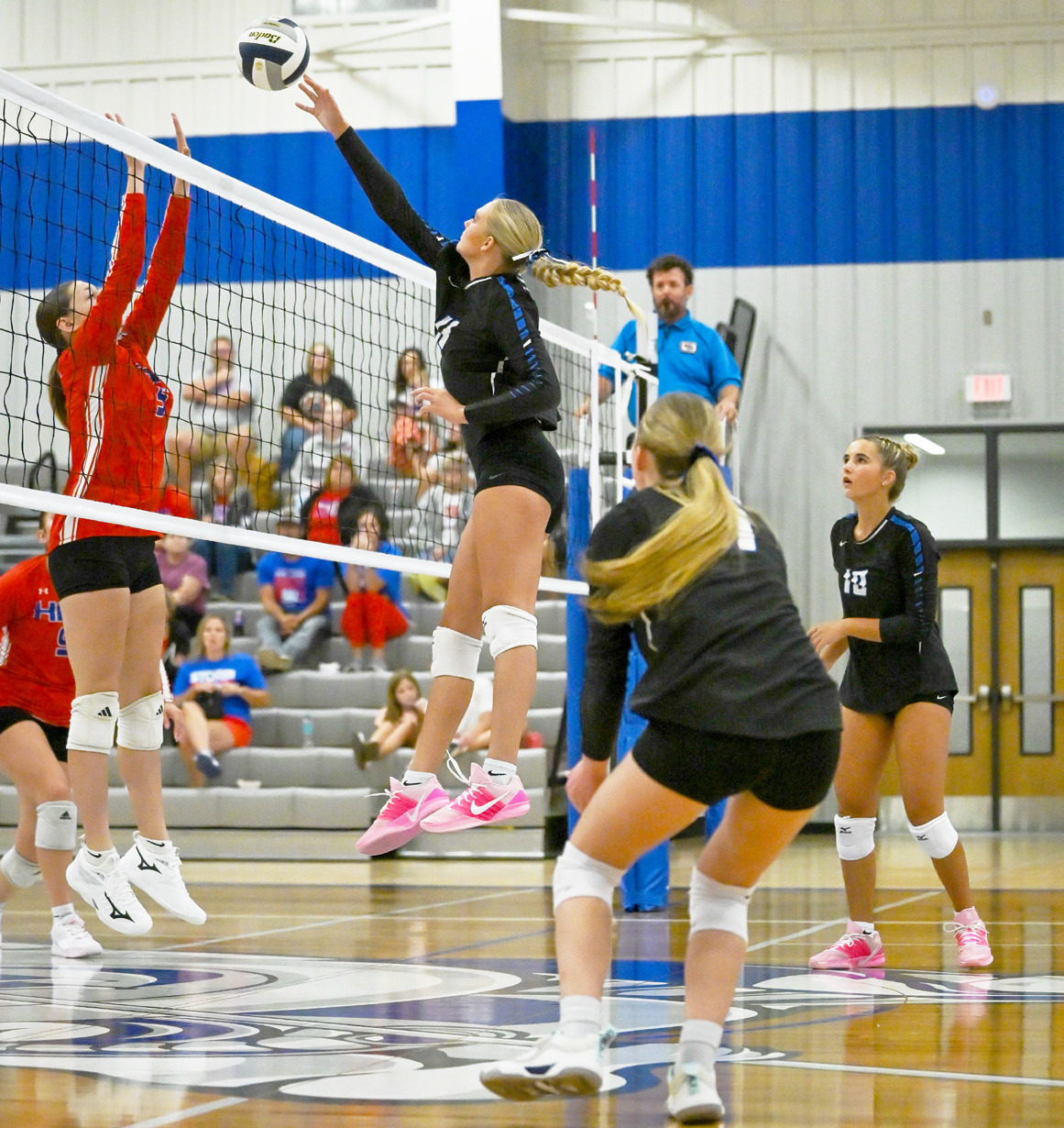 Hallie Jo Urkoski (9) of High Plains tries to block the attack of the Twin River’s front row in Tuesday game in Genoa. Photos by Jen Johnson.
