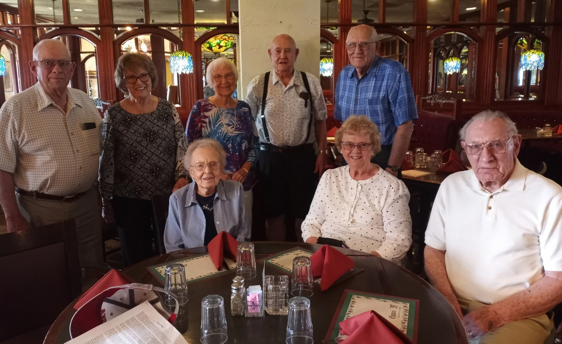 Front Row: Marilyn Ericson Steel, Alice Lindquist Hellbusch and husband, Bob. Back row: Devon Johnson, Jeanine Obrist Hoffman Bryceson, Christine Wegmann Gonnerman, Bob Kreis, Merlin Nyberg
