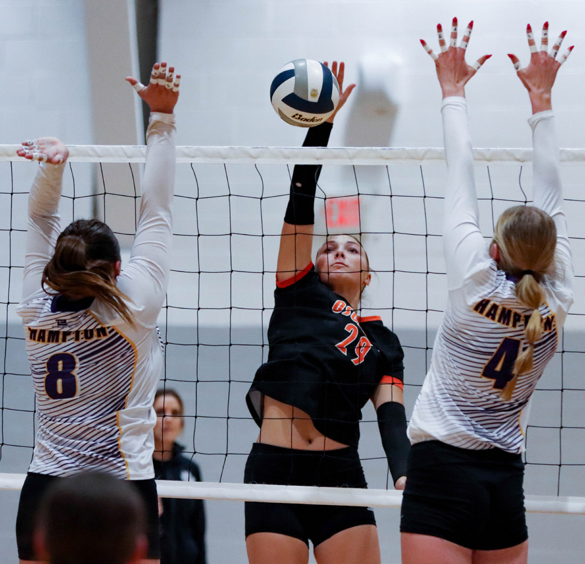 Graci Conkling hits a kill against Hampton. PCN photo by Blaine Winslow.