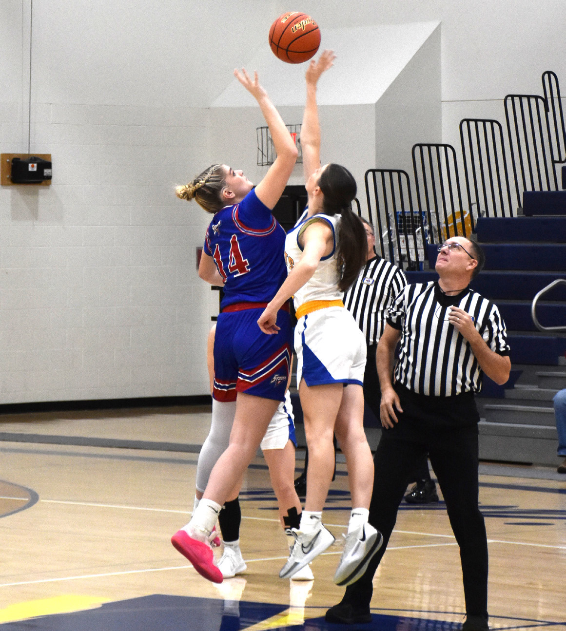 Emma Brown jumps in the tipoff of the girls’ game against Nebraska Lutheran. PCN photo by Beth Sparrow.