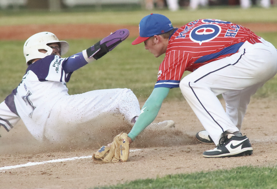SOS’ Ruger Webb beats the tag as he slides into third base during Friday night’s game against David City in Silver Creek at the Ralph Jilg Baseball Tournament. PCN photo by Ken Kush.