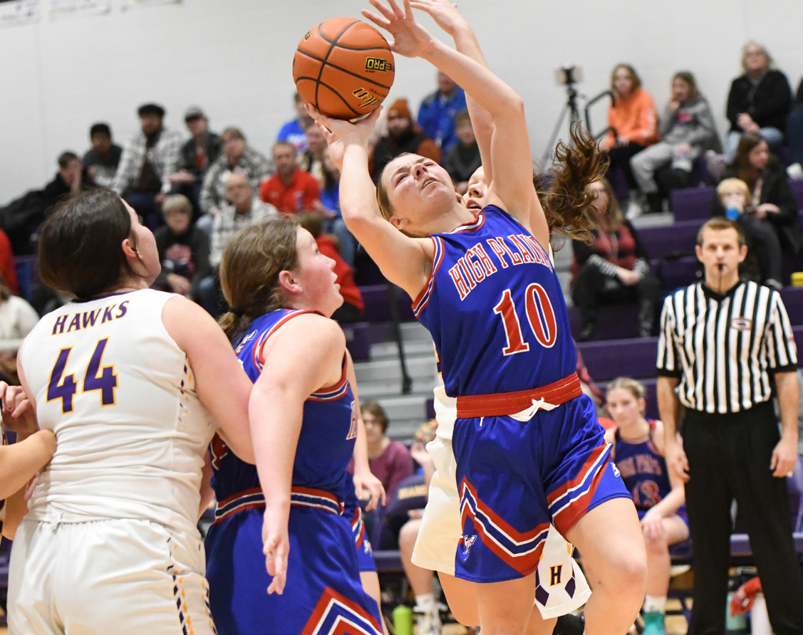 Hailey Lindburg absorbs contact on her way to the basket against Hampton. PCN photo by Calvin Holtz