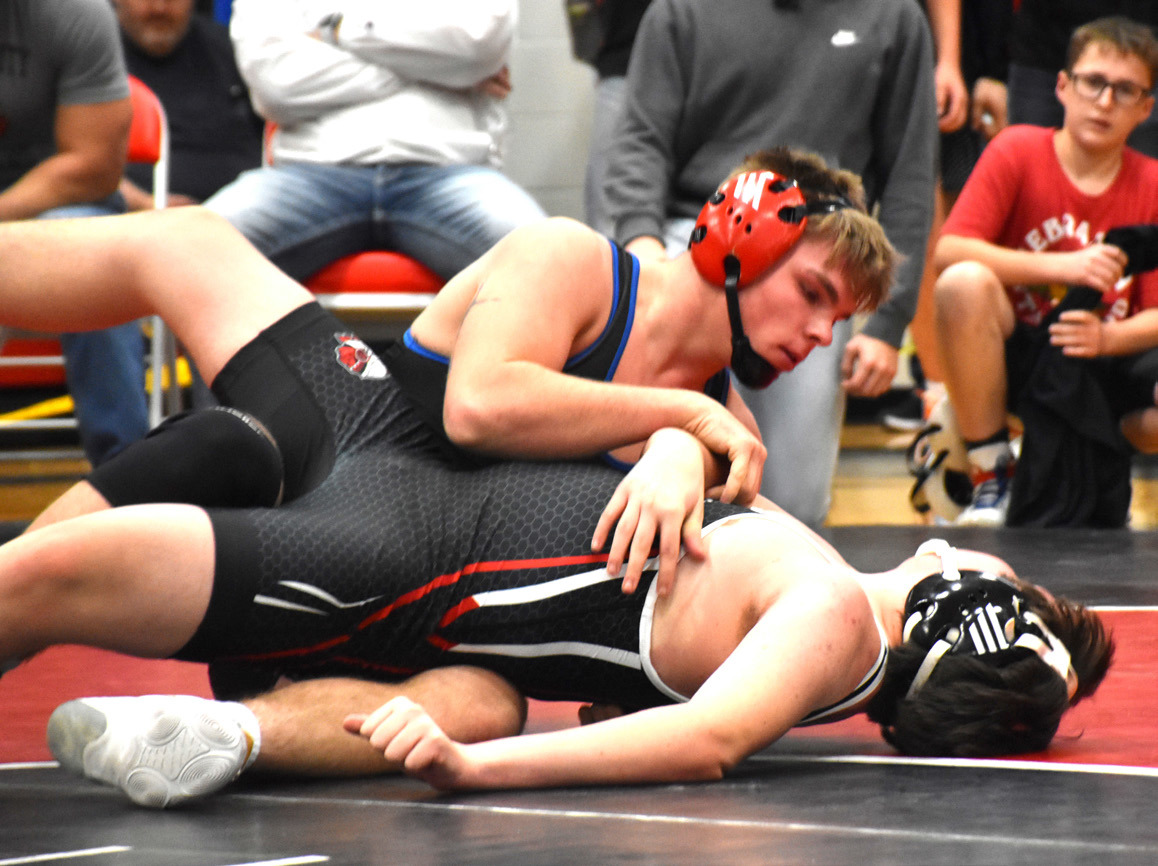 Wyatt Urkoski goes to state for the third year in a row as one of a few undefeated wrestlers. He pins his opponent at districts here. PCN photo by Beth Sparrow.