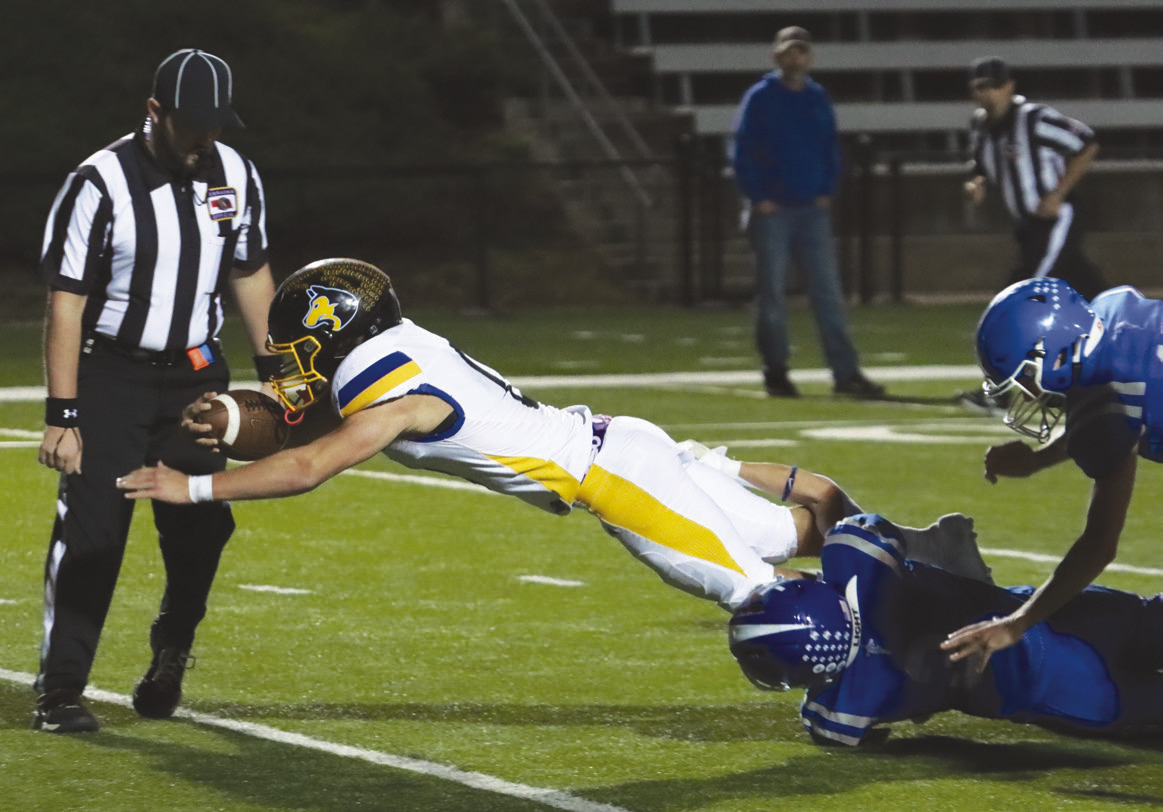 Shelby-RC senior Carter Eickmeier dives over the goal line for his third touchdown of the game at Lourdes Central Catholic onj Friday at Peru State College. He finsihed with 287 yards, and five touchdowns in the D1 battle. PCN photo By Ken Kush