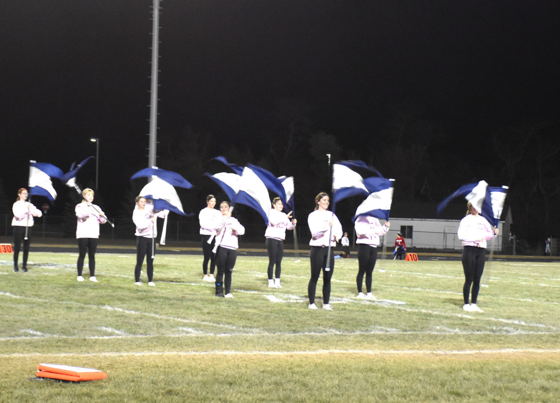 Cougar flag team and drumline perform during a chilly half-time. Above: The Cross County Silver Stars flag team. Below: The Cross County drumline entertained at half.