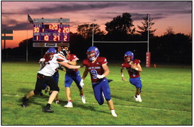 Wyatt Urkoski leads the blocking for Haden Helgoth. PCN photo by Beth Sparrow.
