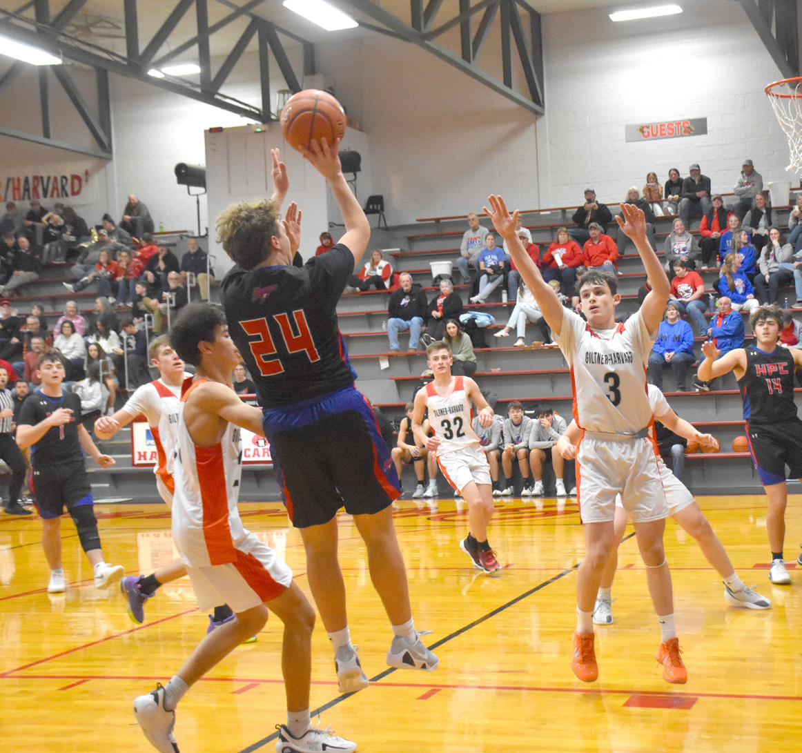 High Plains senbior Chase Owens (24) elevates and puts up the medium range jumper duringf Friday night’s game in Harvard between the Giltner/Harvard Hornets. Owens contributed seven points in the Storm’s win. PCN photo by Beth Sparrow.
