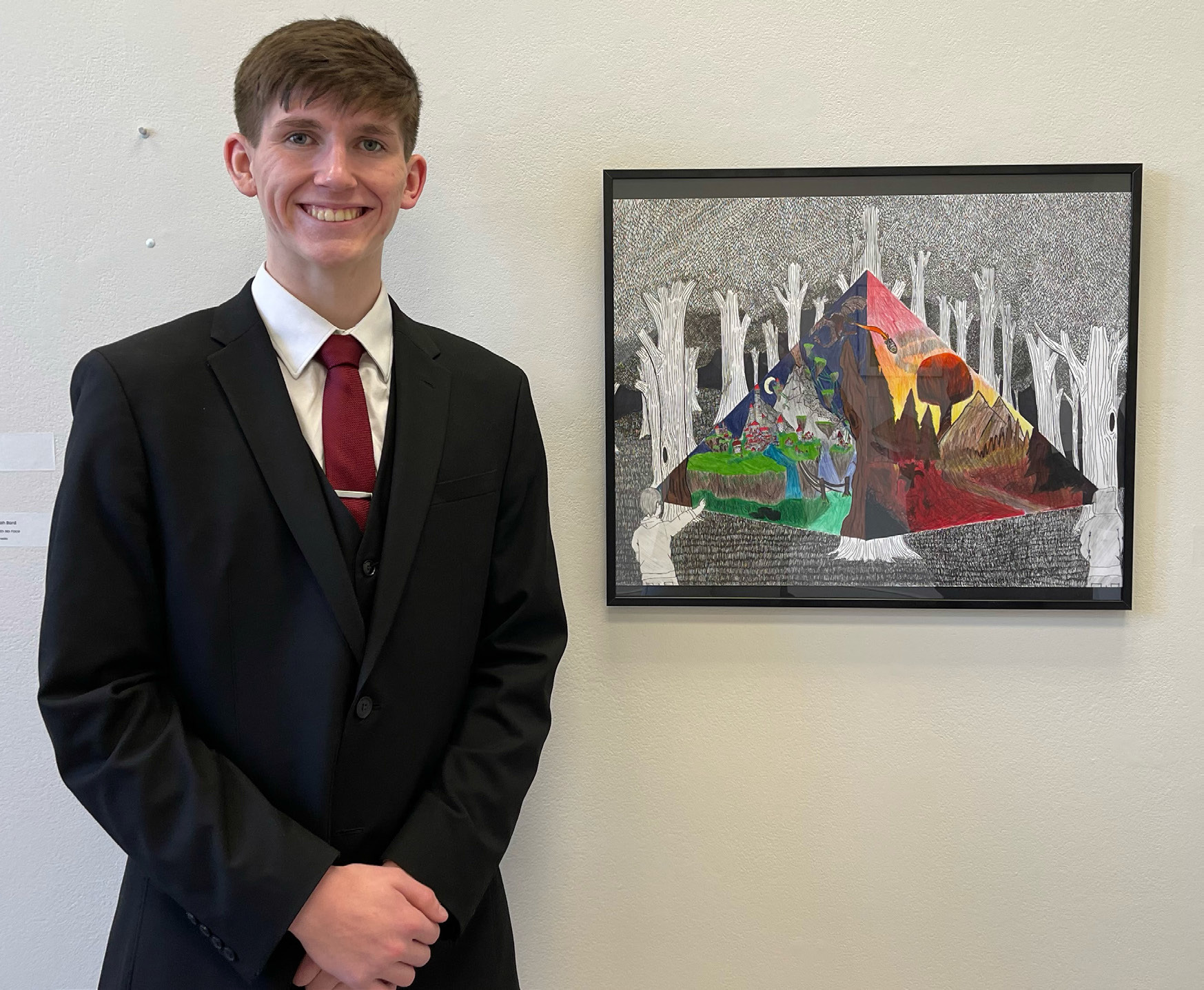 Hayden Lavaley stands next to his award-winning piece of art. The Osceola junior recently was named a Nebraska Young Artist Award winner. Photos provided