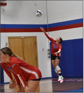 Gahvi Lesiak serves one over earlier this season. PCN file photo by Beth Sparrow.