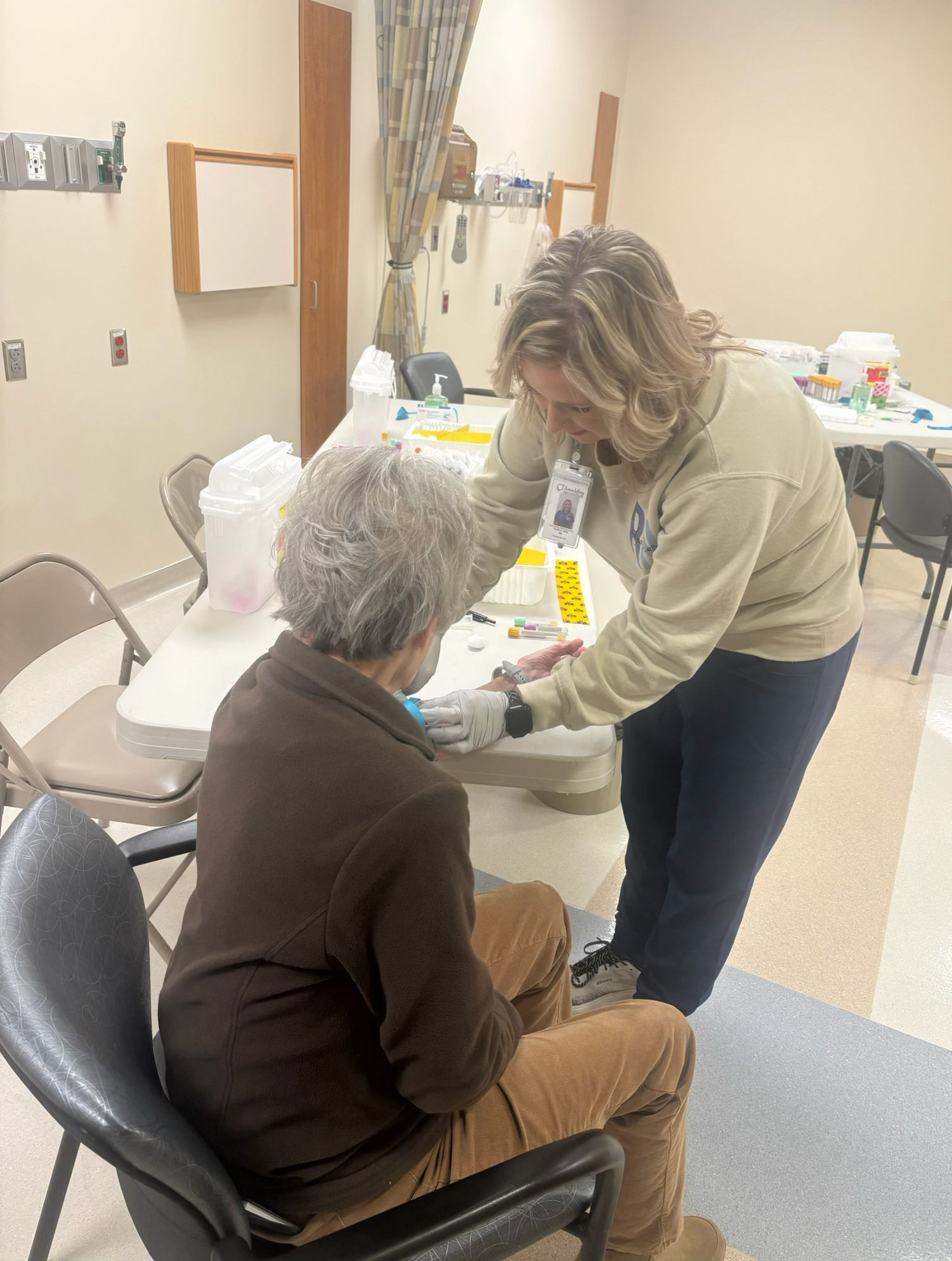 Nurse Heather Roberts does a blood draw on Grace Gerrard at the Annie Jeffrey Memorial County Health Center spring health fair. Photo provided.