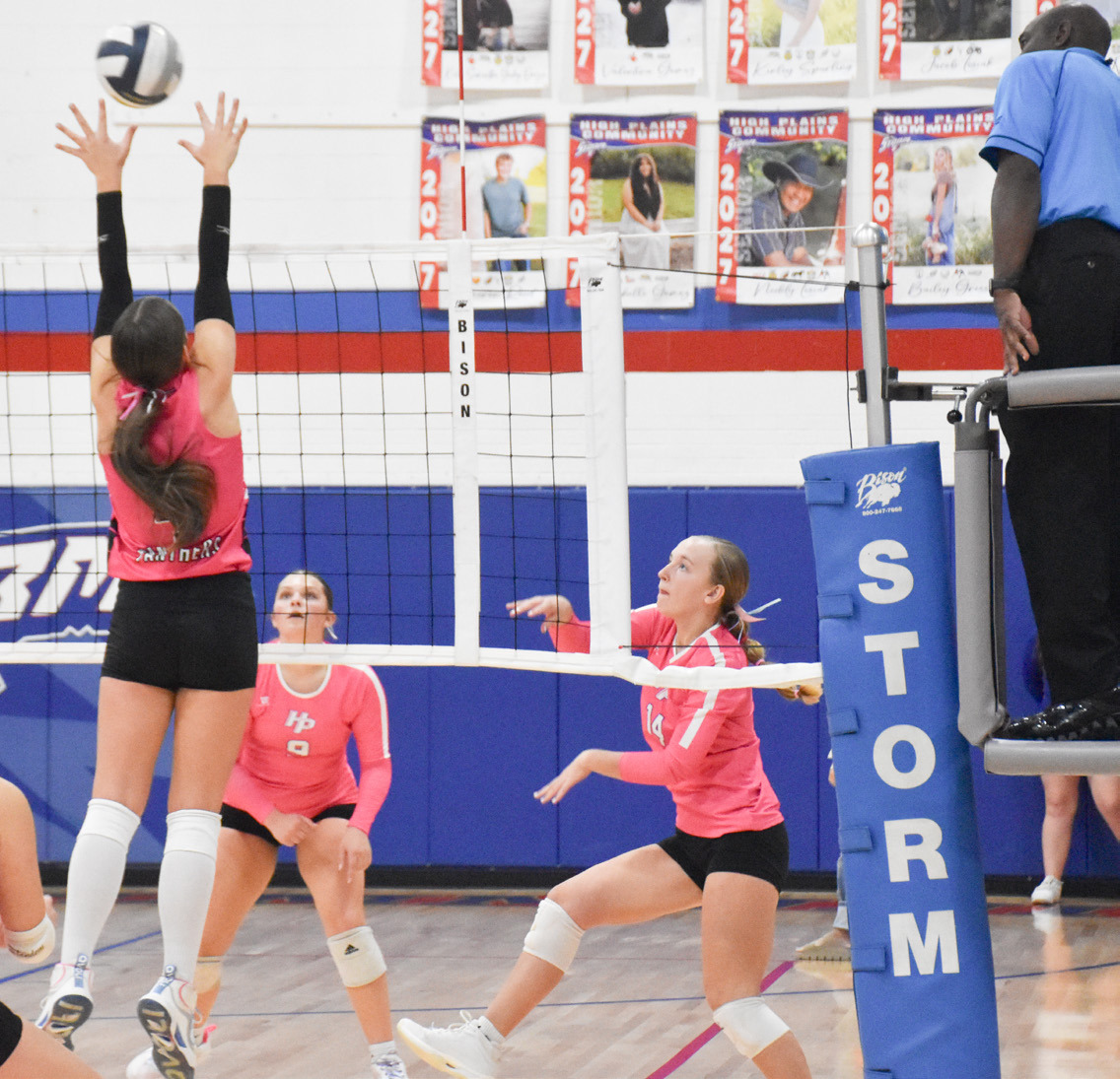 High Plains freshman Peyton Van Pelt send the attack over the Fillmore Central block set up. PCN photo by Beth Sparrow.