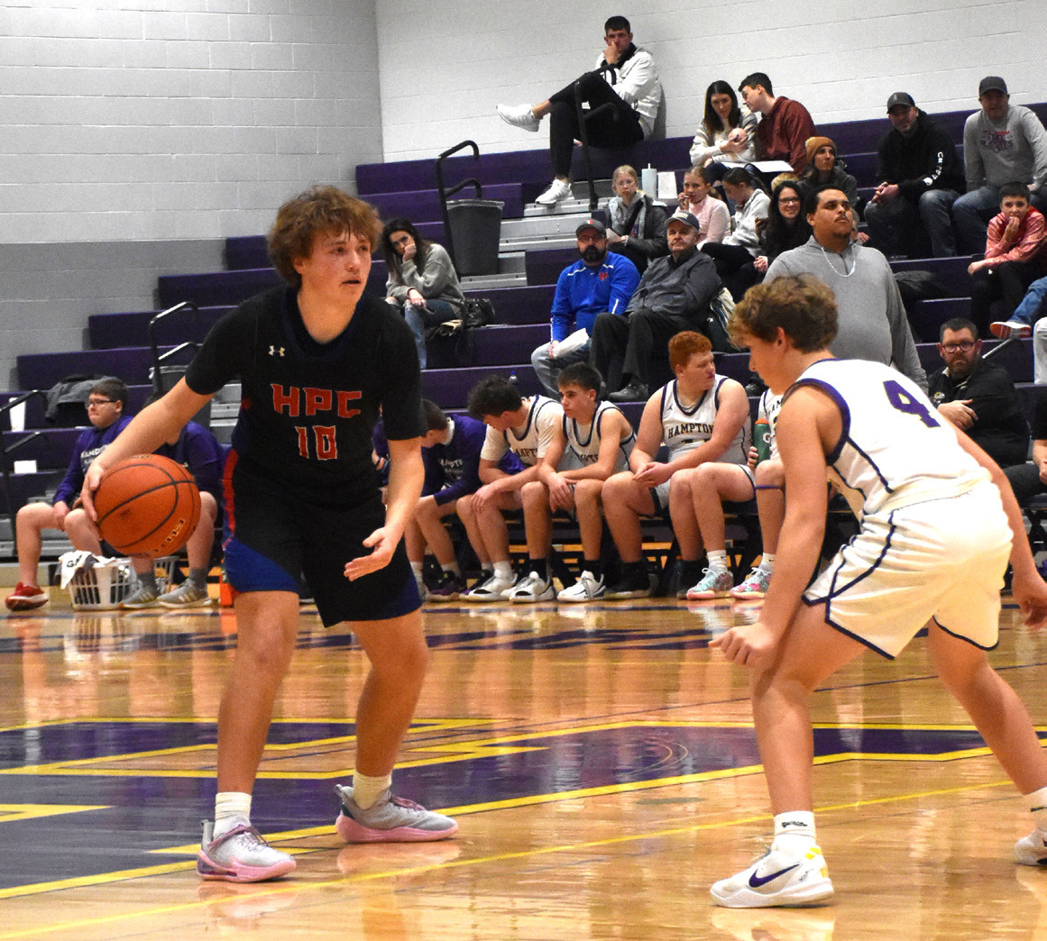 Chase Owens dribbles the ball while a Hampton defender gets ready for the next play. PCN photo by Beth Sparrow.