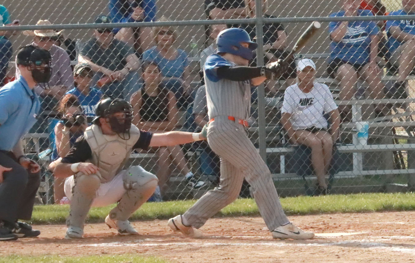 Twin River Titans Aden Feezell drills a line drive single to centerfield in the bottom of third. Feezell had two hits in the loss. PCN photo by Ken Kush.