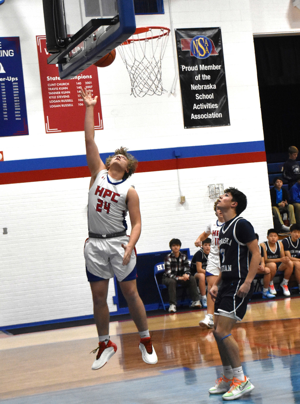Ayden Hans puts the ball up against Nebraska Christian. PCN photo by Beth Sparrow.