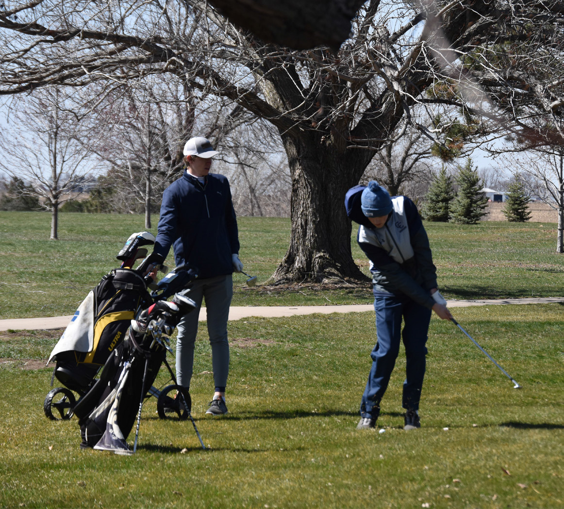 Wyatt Hengelfelt watches as Ashton Seim takes a swing. PCN photo by Cienna Friesen.