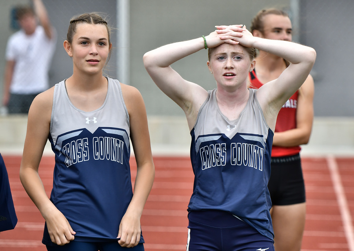 With her hands on her head after running third in the 100 meter finals at the C-6 District, Cross County freshman Piyper Berggren relaizes she would need to wait and see if her time was good enough to qualify for state. As it turned out her 12.39 (best of the year) was best among the non-automatic qualifiers in Class C. PCN photo by Rick Holtz