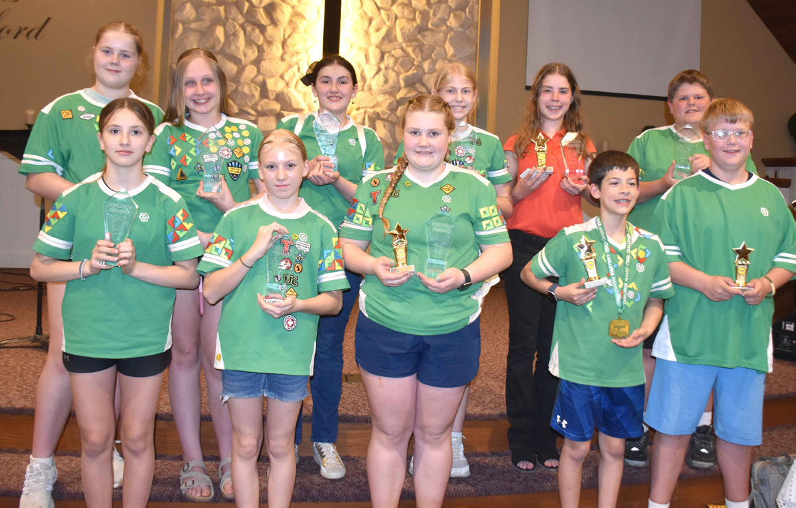Pictured are AWANA Timothy award winners (clear trophy) and Clubbers of the year (gold star trophy): Taytum McLean, Serena Bauer, Cedar Johnson, Jackson Phillips, Sawyer Mundt; (back) Violet Peterson, Adelace Wilgocki, Penny Holtz, Evelyn Coffin, Addison King, and Sam Tonniges. PCN photo by Beth Sparrow.