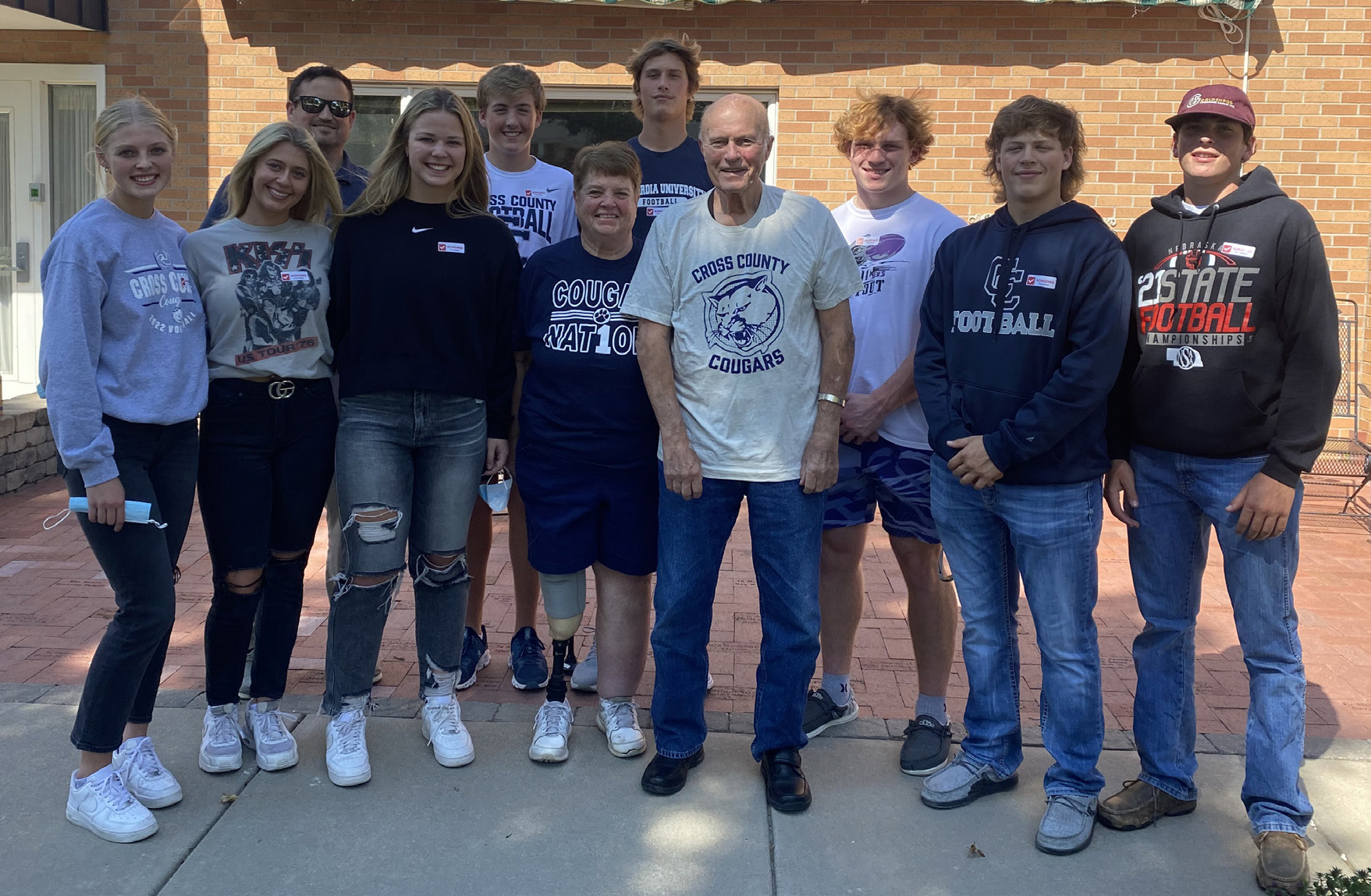Bren Lemburg (left), Taylor Lindburg, Mr. Jimmy Blex, Jayden Fellows, Ashton Seim, Sue Lehn, Tanner Hollinger, Larry Lehn, Izaac Dickey, Andrew Dubas, Treven Nienhueser. Larry Lehn (and wife Sue) were visited by Cross County athletes and presented with a Cougar T-shirt as one of MCH’s Fan of the Week. T-shirt provided by Cross County Booster Club. Photo provided by Erin Dickey.